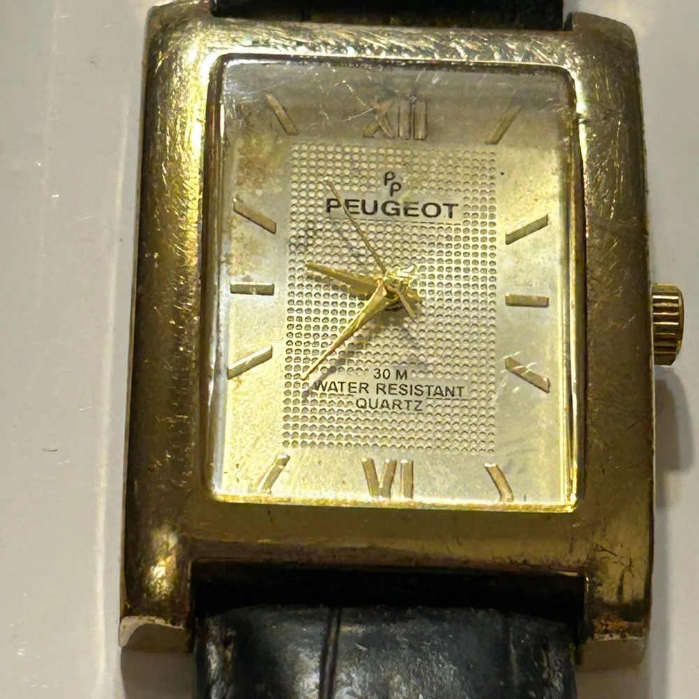 Peugeot Gold and Black Timepiece